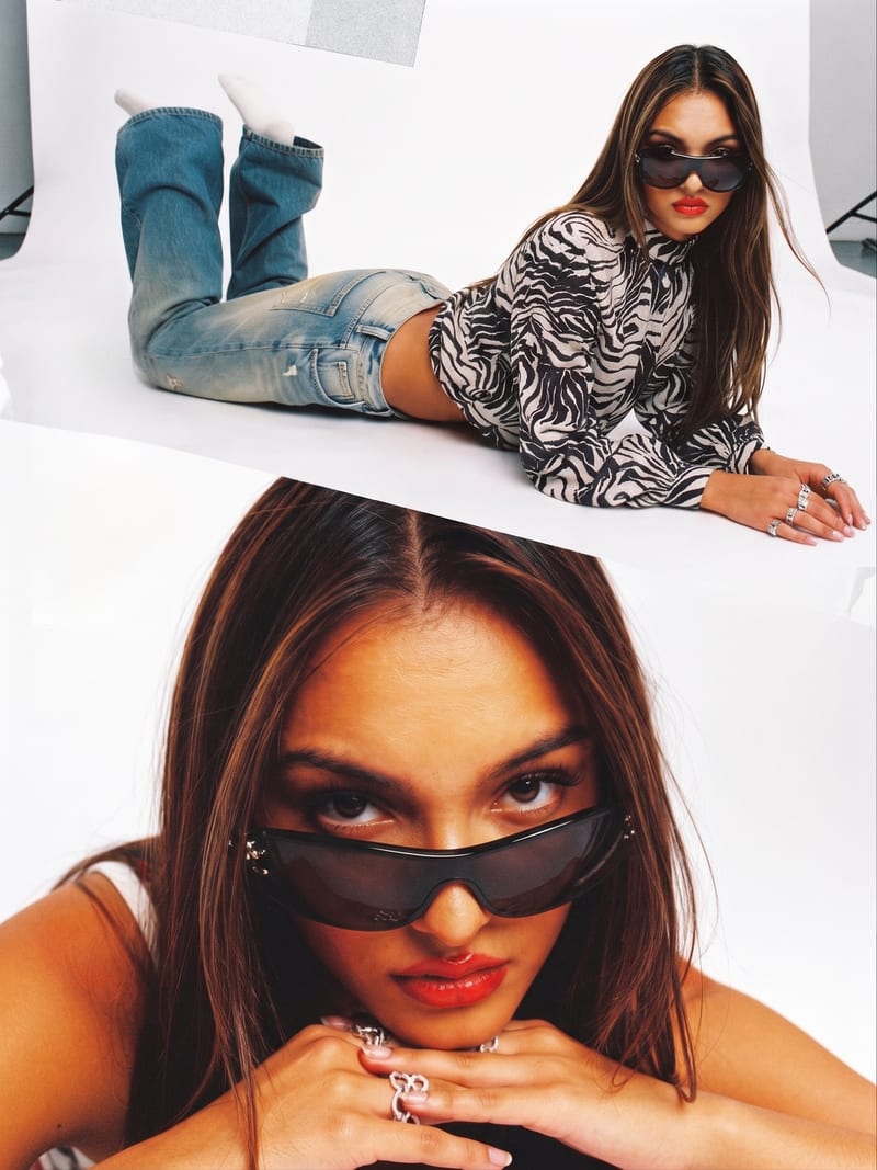 Magazine spread of the Zola Track Jacket: lying on the studio floor in sunglasses, and a close up